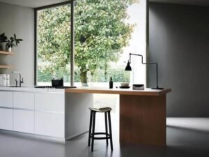 wholesale assembled kitchen cupboards for resellers by Starwood,Modern kitchen island with bar‑height seating and storage modules.Modern kitchen cabinet set in glossy white finish, showcasing panel furniture manufacturing.