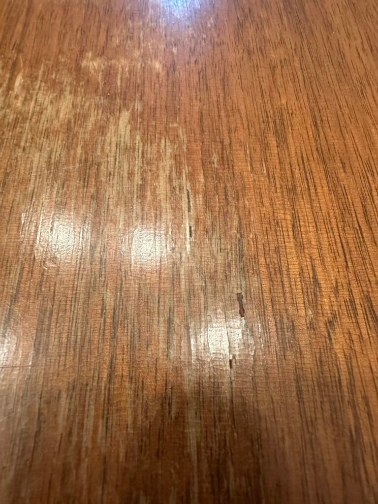 Swollen and warped plywood furniture damaged by moisture