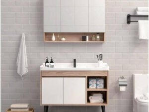 Modern bathroom with a wall-hung plywood vanity, quartz top, and backlit mirror.