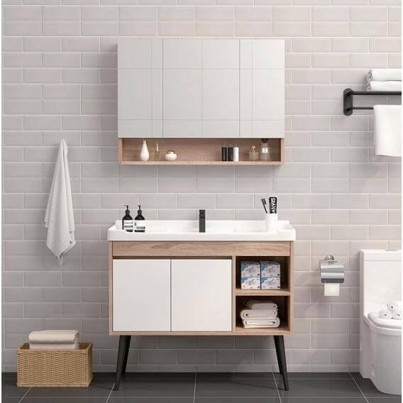 Modern bathroom with a wall-hung plywood vanity, quartz top, and backlit mirror.
