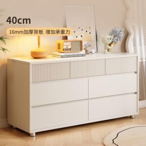 four-drawer chest of drawers with metal handles and solid wood legs