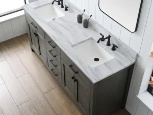 Bathroom vanity with tall cabinet set in a small hotel bathroom
