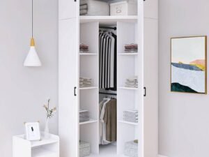 Custom corner wardrobe closet for small bedrooms, made of high-quality plywood, with hanging space, drawers, and shelves, available in wood or white finish.