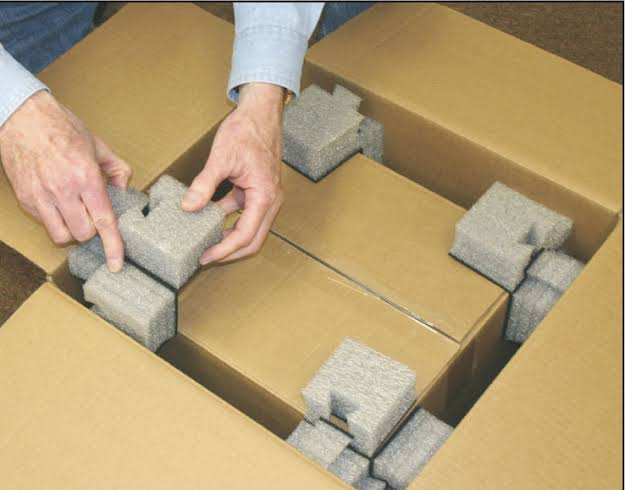 RTA flat pack bookcase packaging with corner guards and scratch film