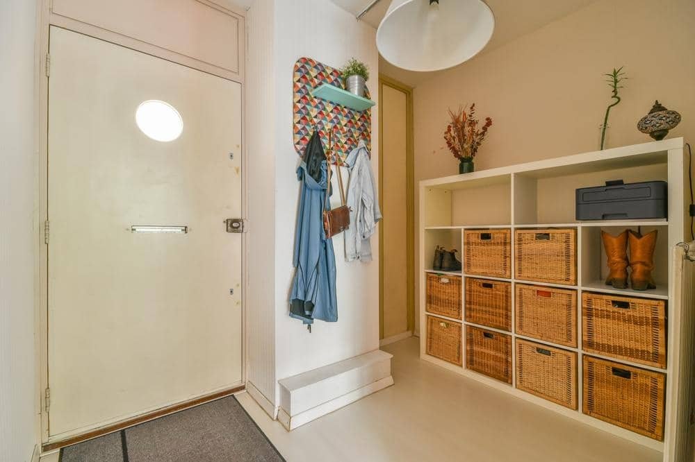 narrow wardrobe closet installed in a hallway niche