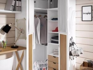 A hero shot of a modern small bedroom with a corner or narrow wardrobe.