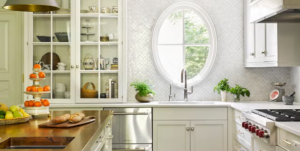 Modern kitchen with sleek white cabinets and pull-out drawers, showcasing a minimalist design.