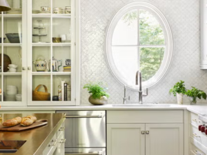 Modern kitchen with sleek white cabinets and pull-out drawers, showcasing a minimalist design.