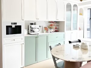 Apartment dining room storage wall with glass display cabinet