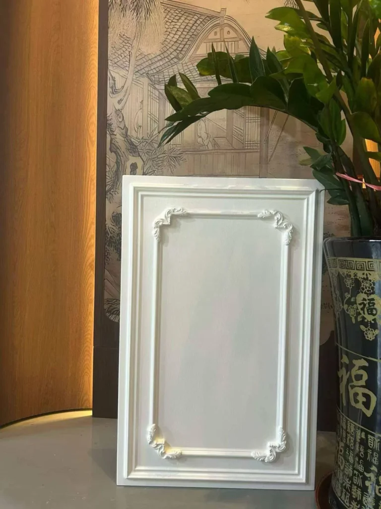 Decorative white PVC-wrapped MDF cabinet door with molded frame details